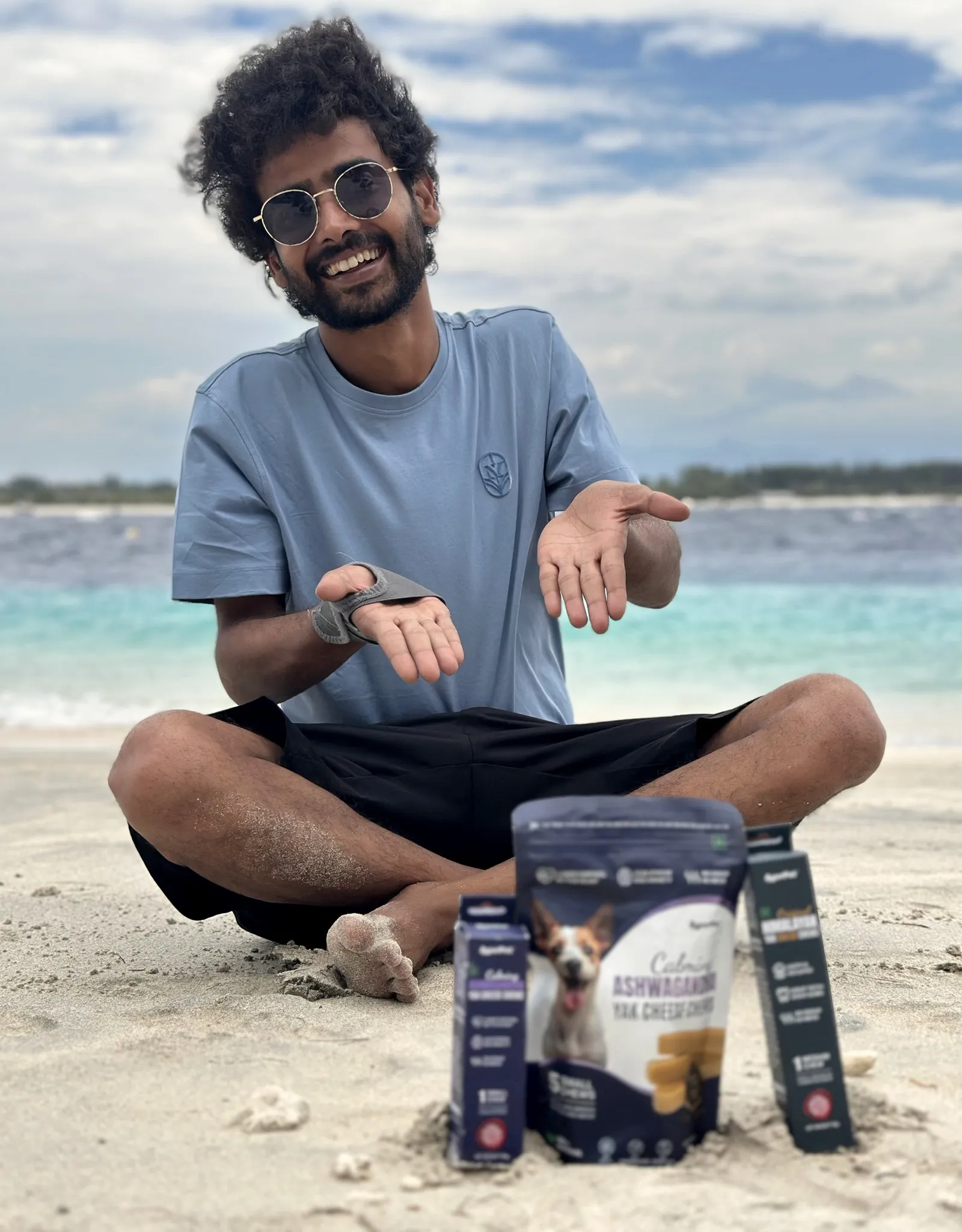 Divyanshu, founder of IndoFolk Wellness, holding a pack of Ashwagandha yak cheese chews